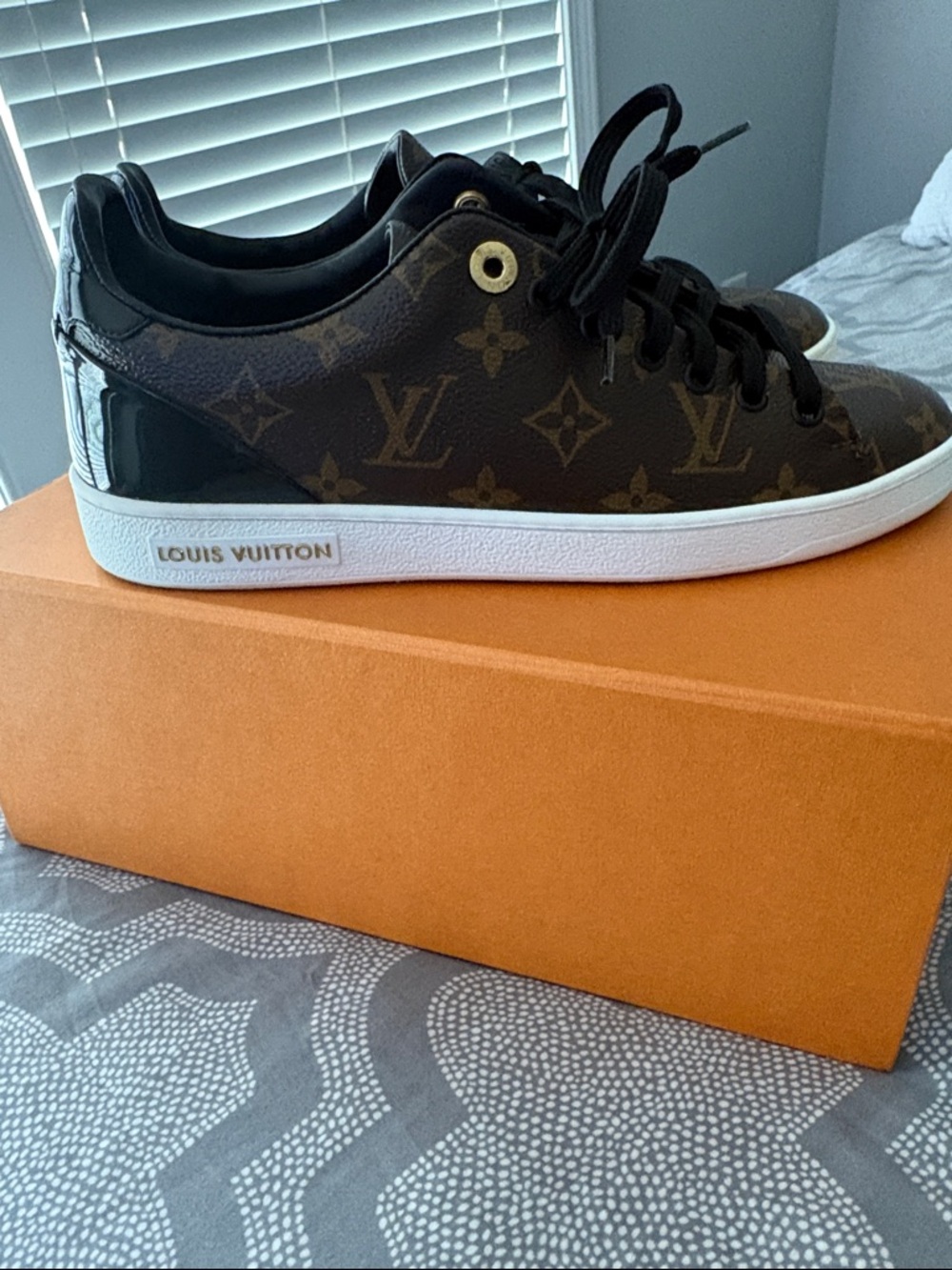 Louis Vuitton Monogram Low-Top Sneakers W/Black Accents
Ship next business day